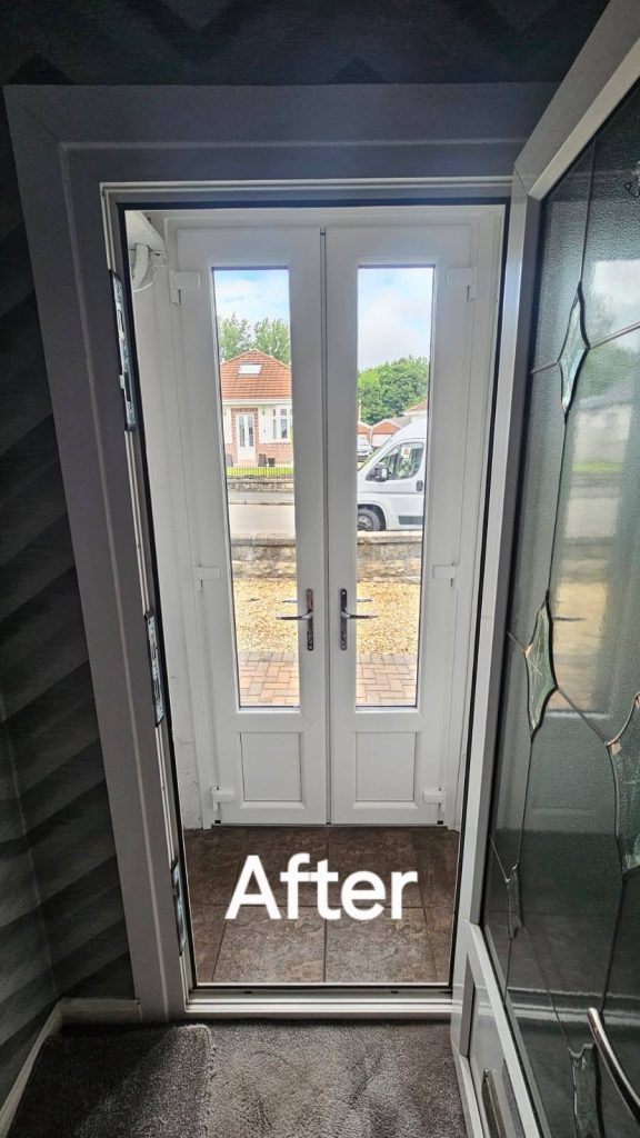 After: the new French doors from inside, white frames with full-length glass