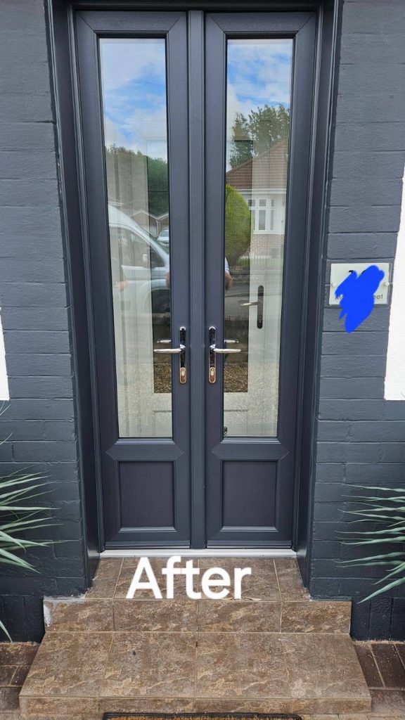 After: new anthracite grey French doors with full-length glazing, above stone steps
