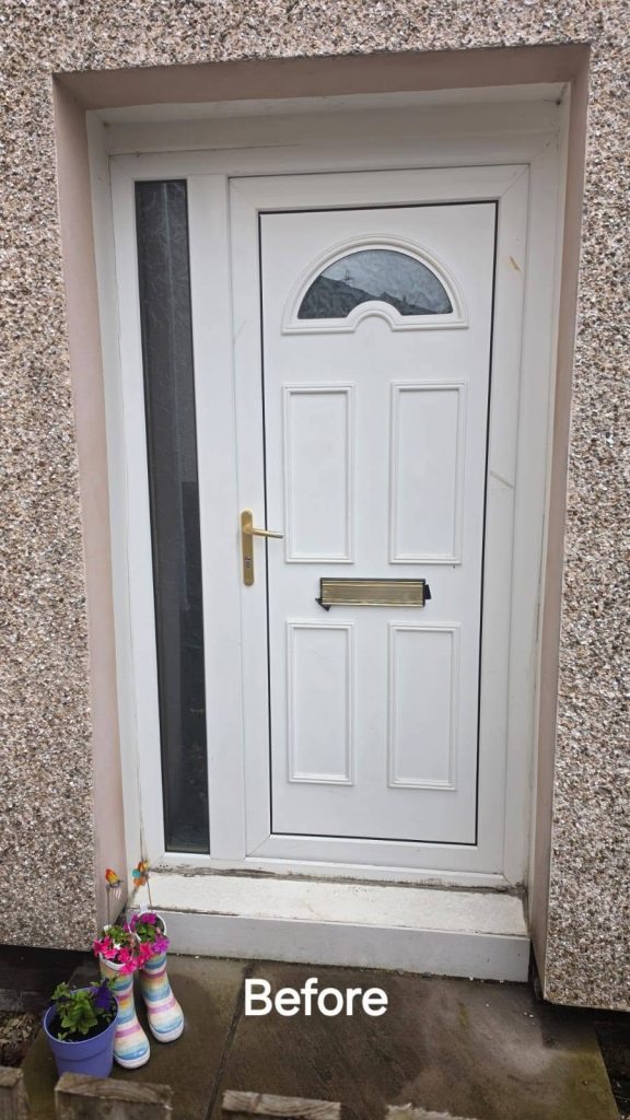 Before: the old white front door and narrow side panel that were replaced