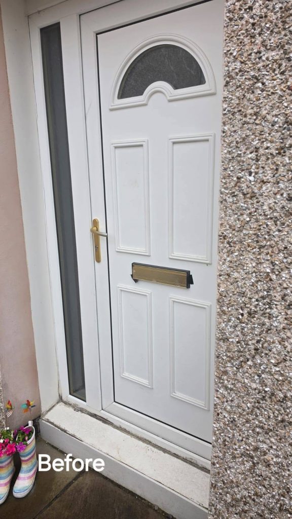 Before: close-up of the old white front door with a half-moon glass panel