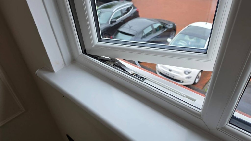 Close-up of the internal sill and frame on a new white uPVC window in Yoker